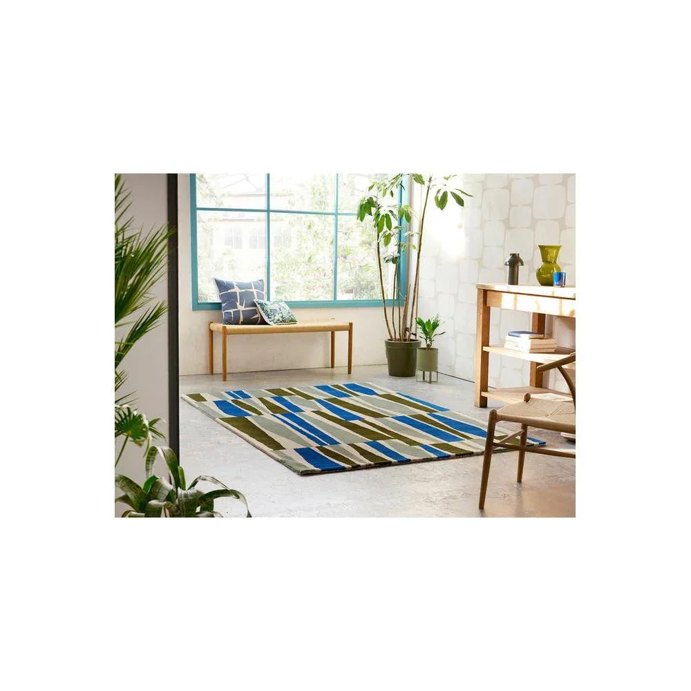 Scion Saku Olive Rug featuring abstract striped pattern in olive, emerald, navy, sky blue on cream background, hand-tufted wool