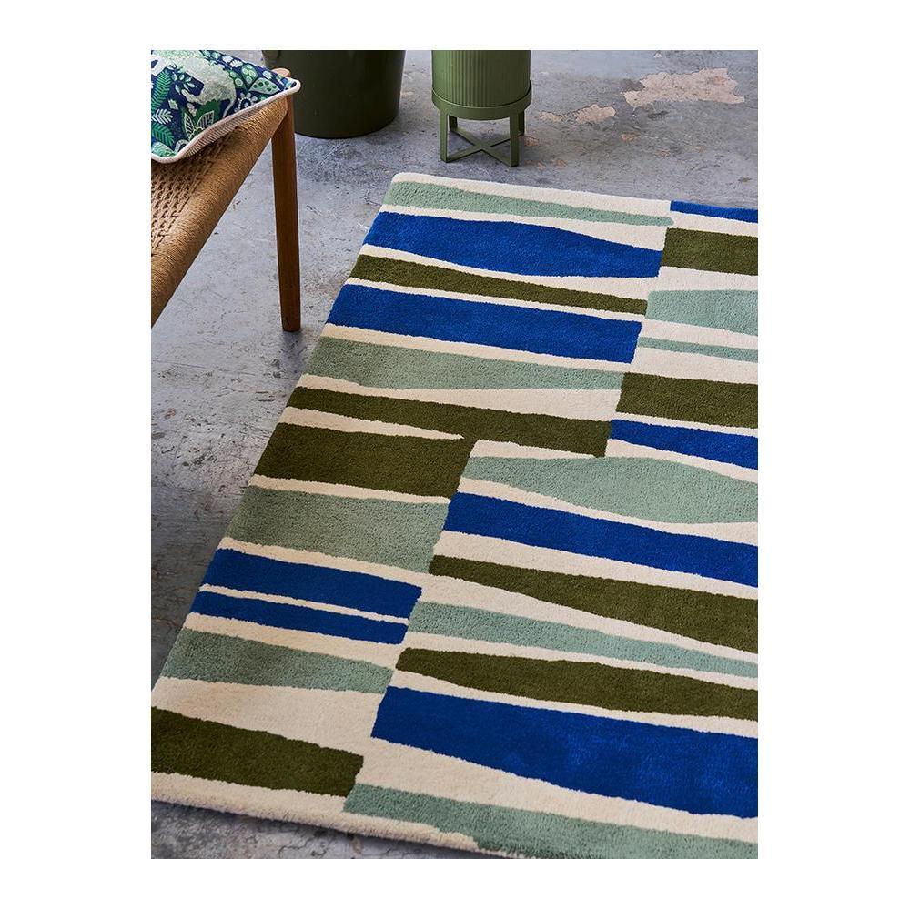 Scion Saku Olive Designer Rug featuring geometric stripe blocks in royal blue, olive, sage and cream on ivory background, hand-tufted wool