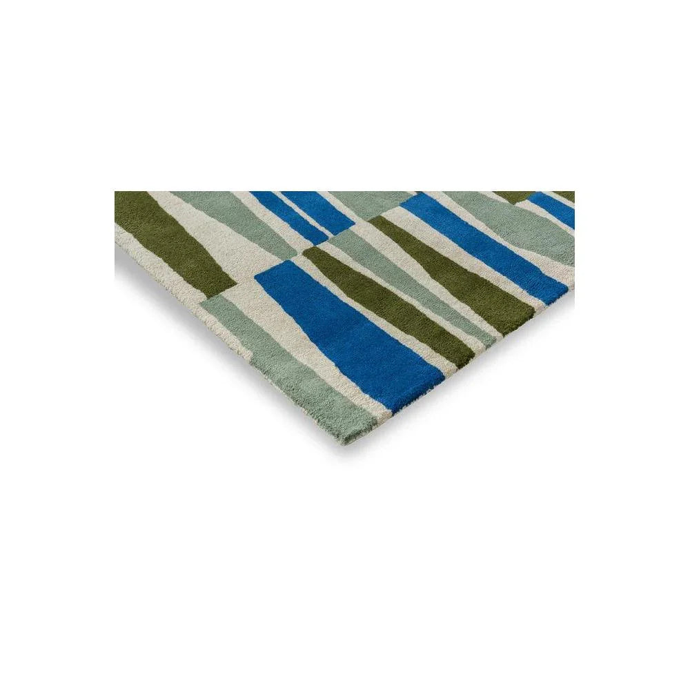 Scion Saku Olive Rug with bold striped pattern in olive, royal blue, sage and cream on light grey, hand-tufted wool