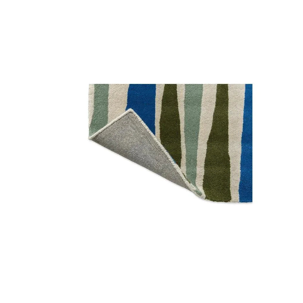 Scion Saku Olive Designer Rug featuring vertical stripe pattern in olive, sage, cream and cobalt blue on ivory background, hand-tufted wool