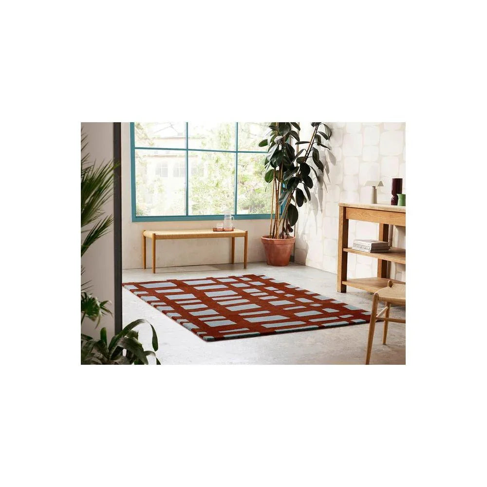 Scion Arlo Brick Designer Rug featuring geometric grid pattern in brick red and pale teal on cream background, woven wool