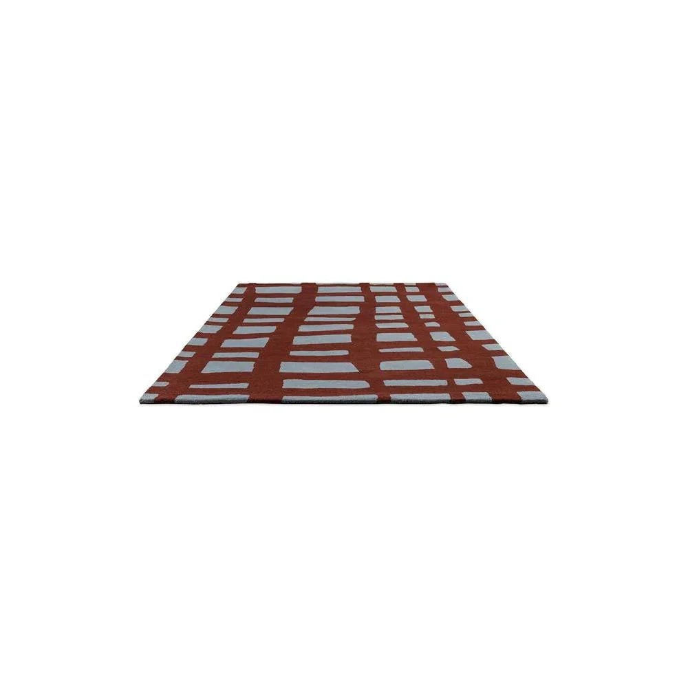 Scion Arlo Brick Designer Rug featuring geometric grid in brick red and light grey on light background, machine-made polypropylene