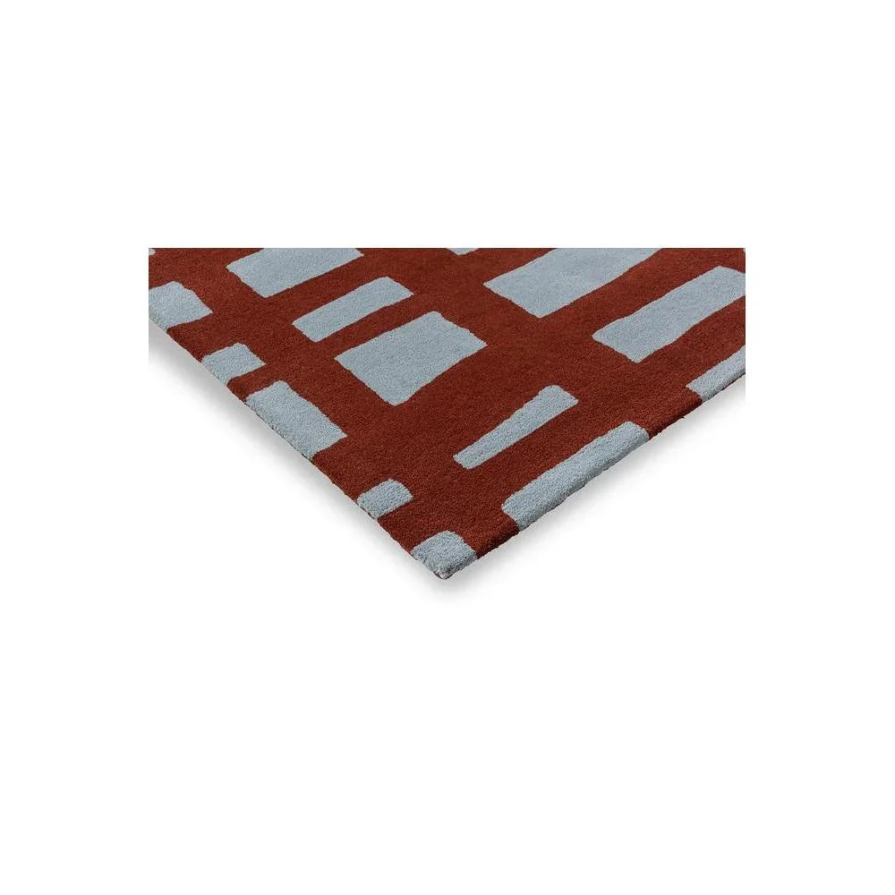 Scion Arlo Brick Designer Rug featuring geometric grid pattern in brick red and pale blue on light background, hand-tufted wool