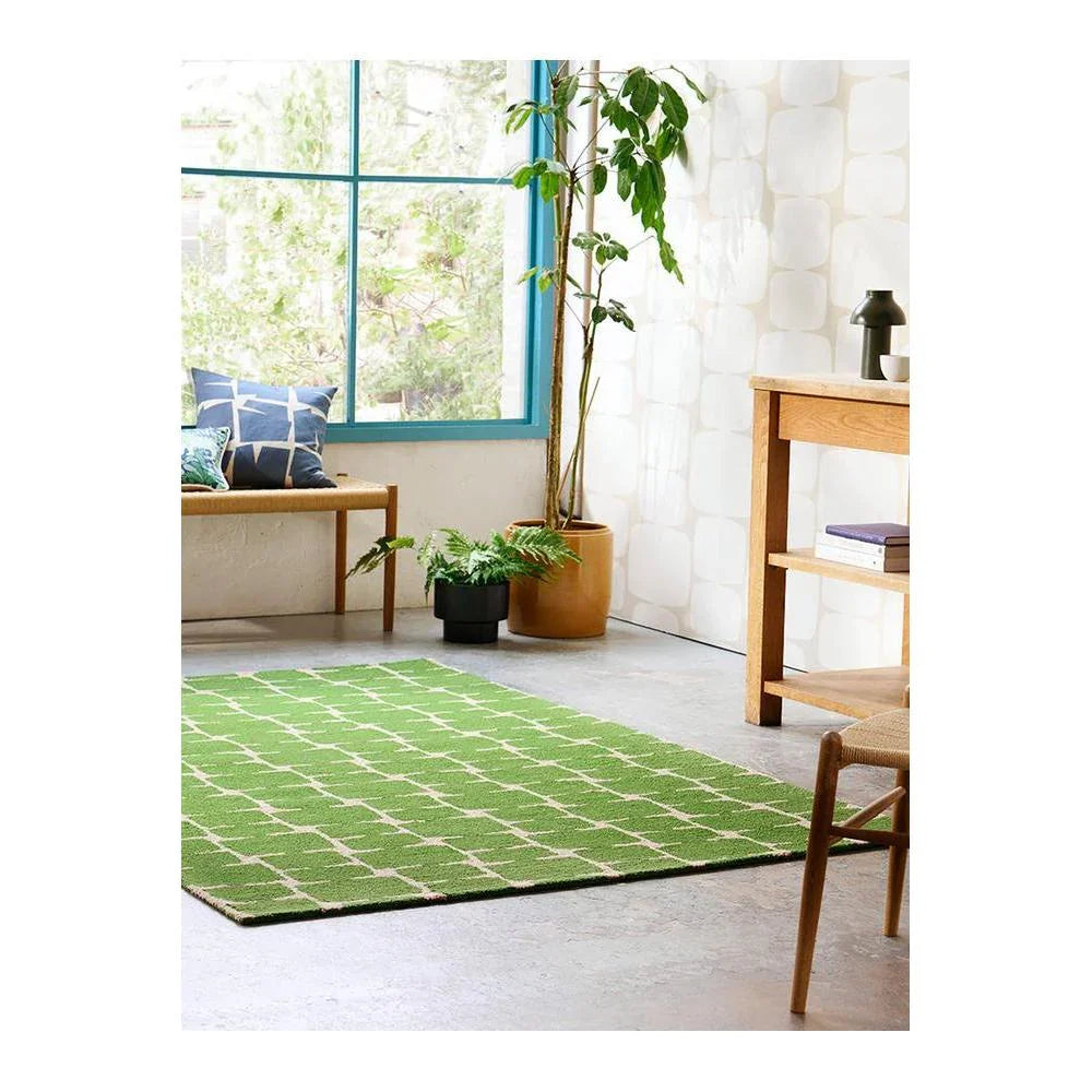 Scion Little Lohko - Juniper Rug featuring lattice pattern in juniper green and white on pale cream background, hand-tufted wool