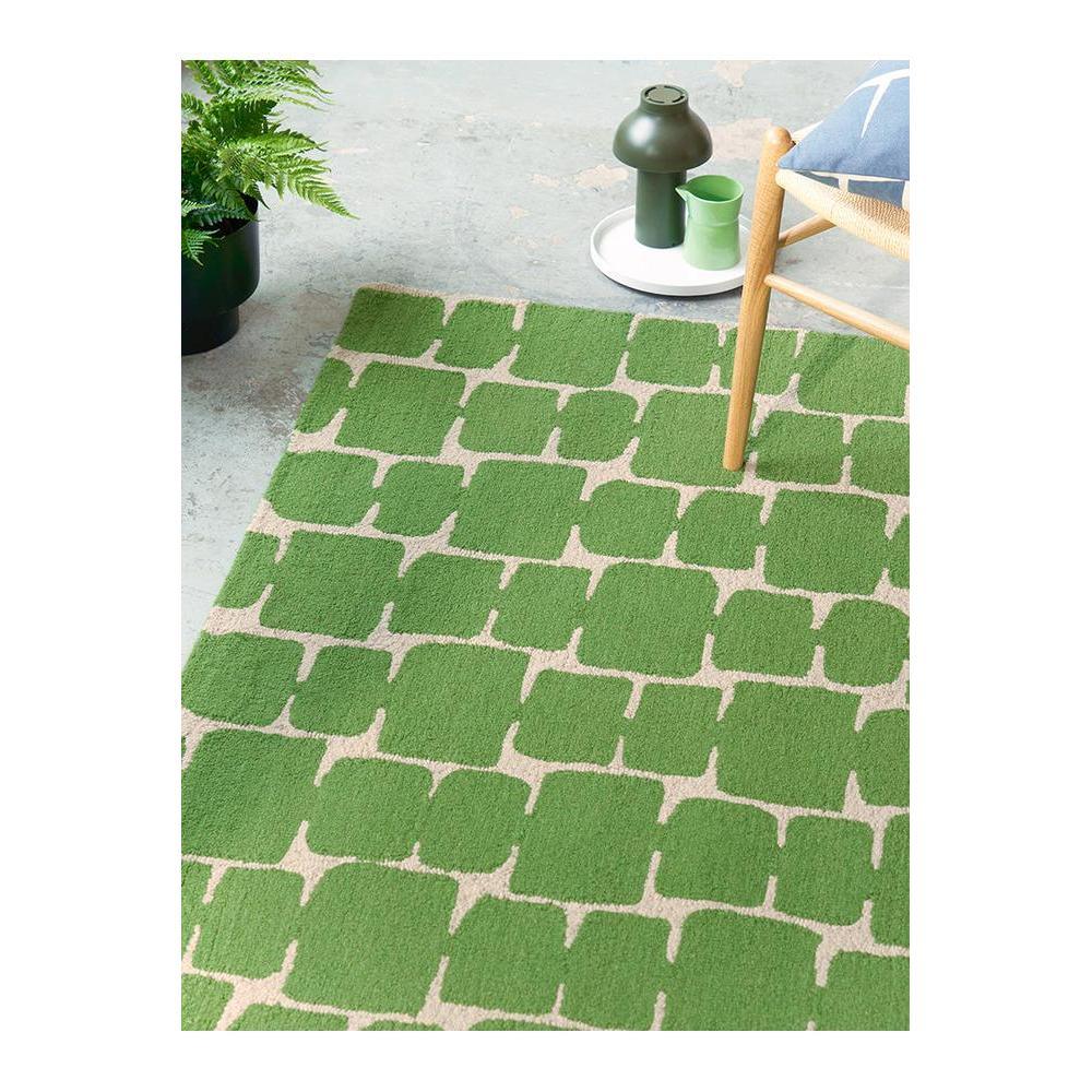 Scion Little Lohko Juniper Rug featuring geometric block pattern in emerald green and cream on beige background, hand-tufted wool