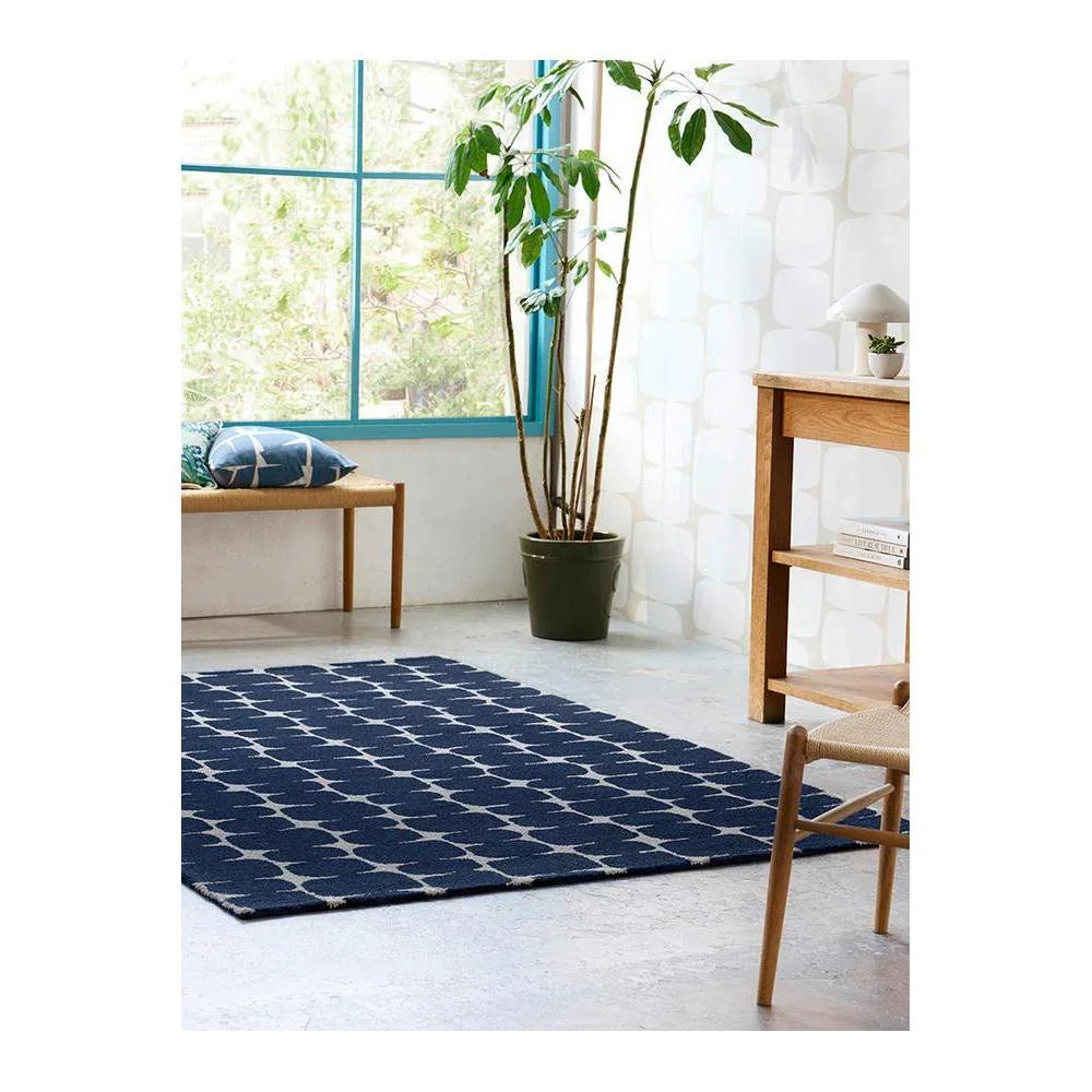 Scion Little Lohko Indigo Designer Rug featuring geometric lattice pattern in navy indigo and cream on navy background, woven wool