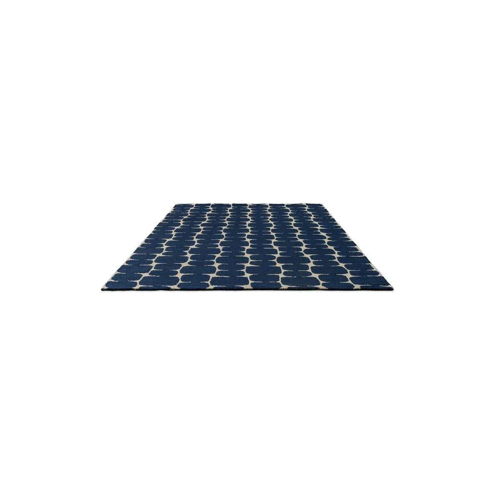 Scion Little Lohko Indigo designer rug featuring circular dot pattern in navy on cream background, hand-tufted wool