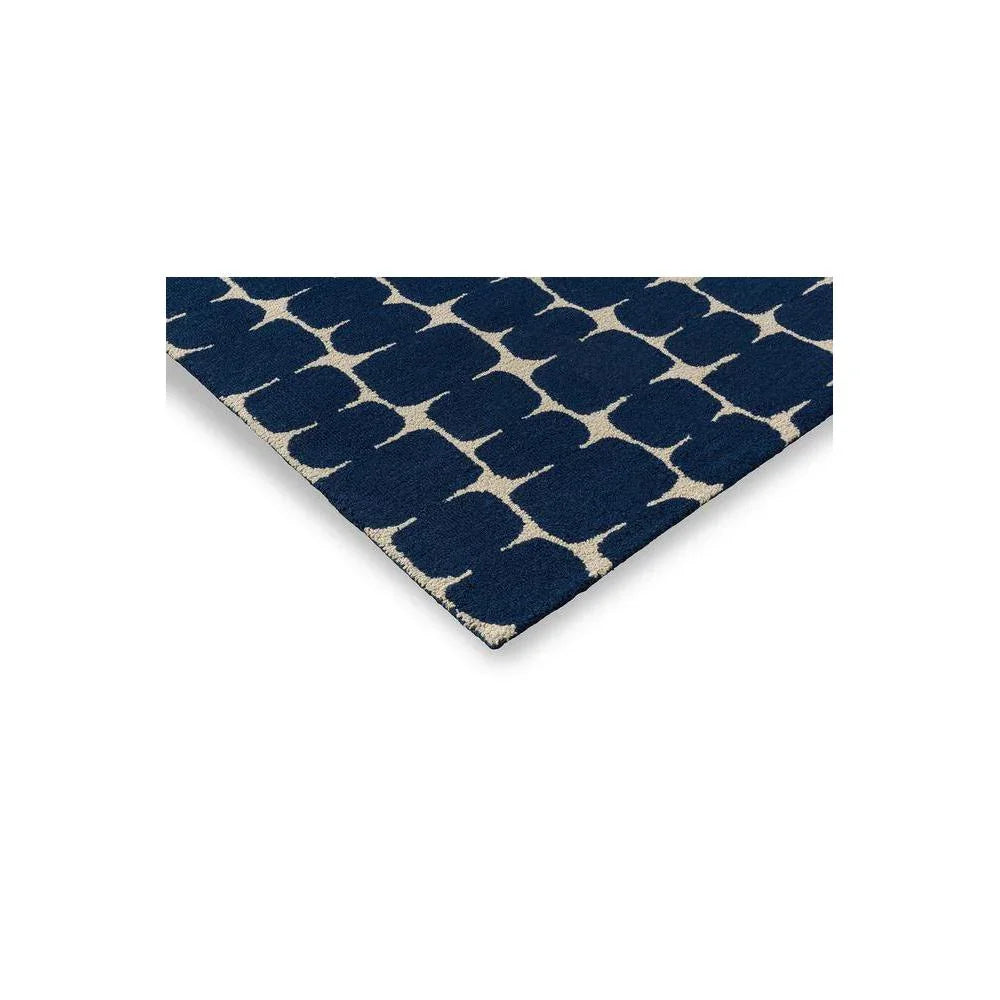 Scion Little Lohko Indigo Rug featuring geometric lattice in navy blue and cream on white background, hand-tufted wool