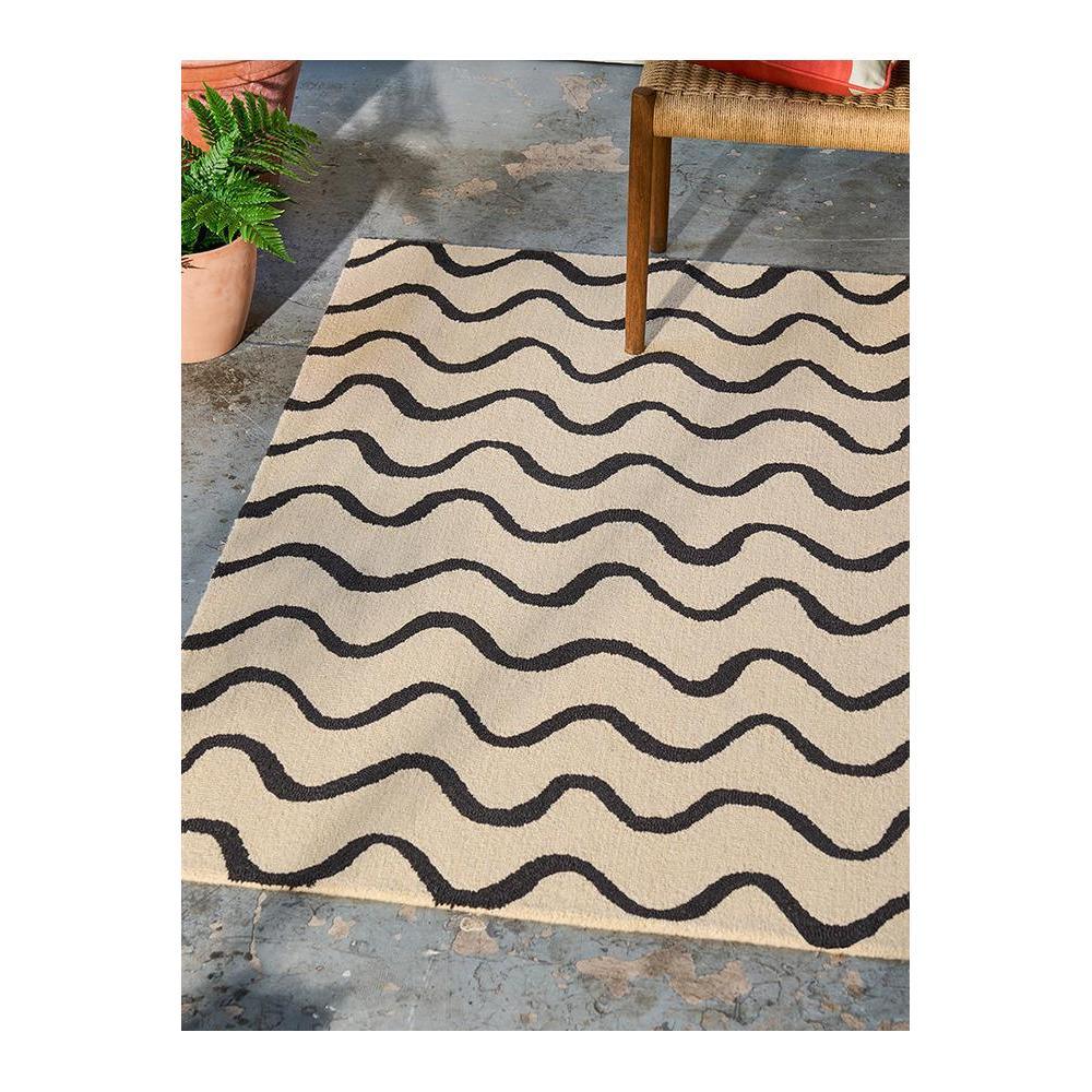 Scion Ribbon Charcoal Designer Rug featuring wavy black stripe pattern in black and beige on beige background, hand-tufted wool