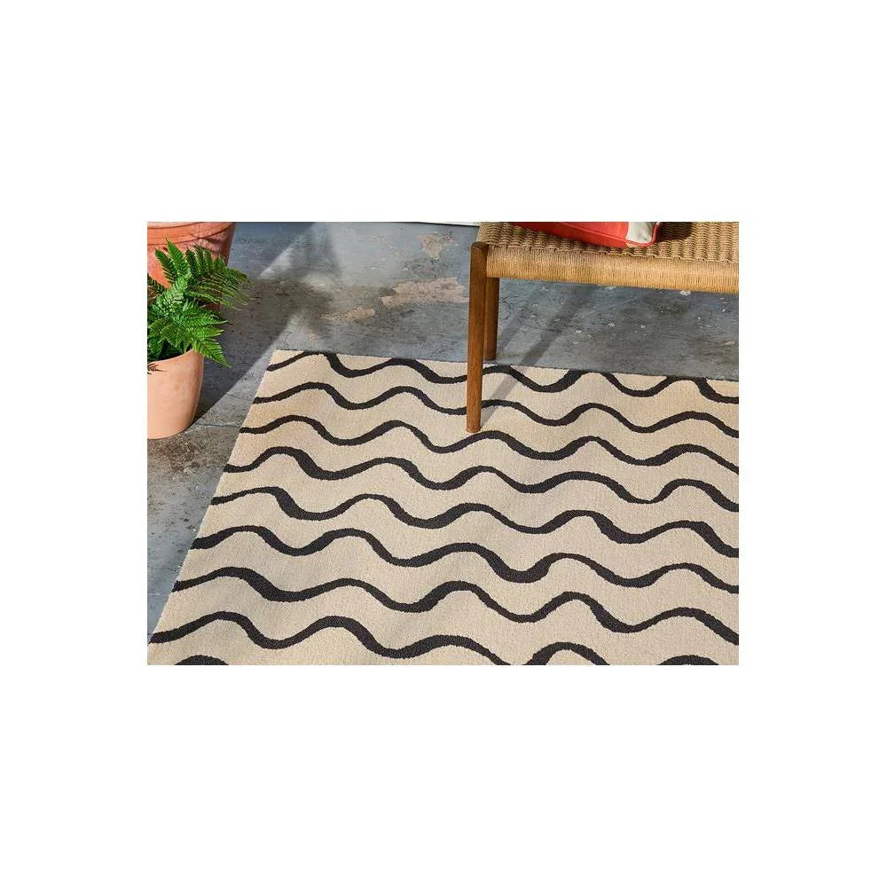 Scion Ribbon -Charcoal Designer Rug featuring wavy stripe pattern in beige and charcoal on light beige background, hand-tufted wool