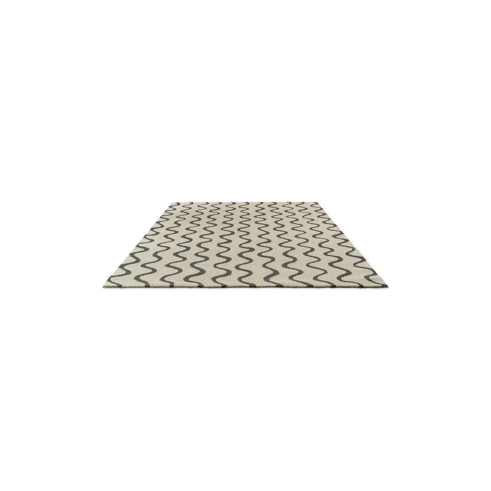 Scion Ribbon - Charcoal Designer Rug featuring wavy ribbon pattern in charcoal and cream on beige background, machine-made wool
