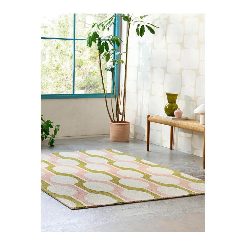 Scion Billow Lichen rug featuring retro wave pattern in cream, blush pink and olive on ivory background.