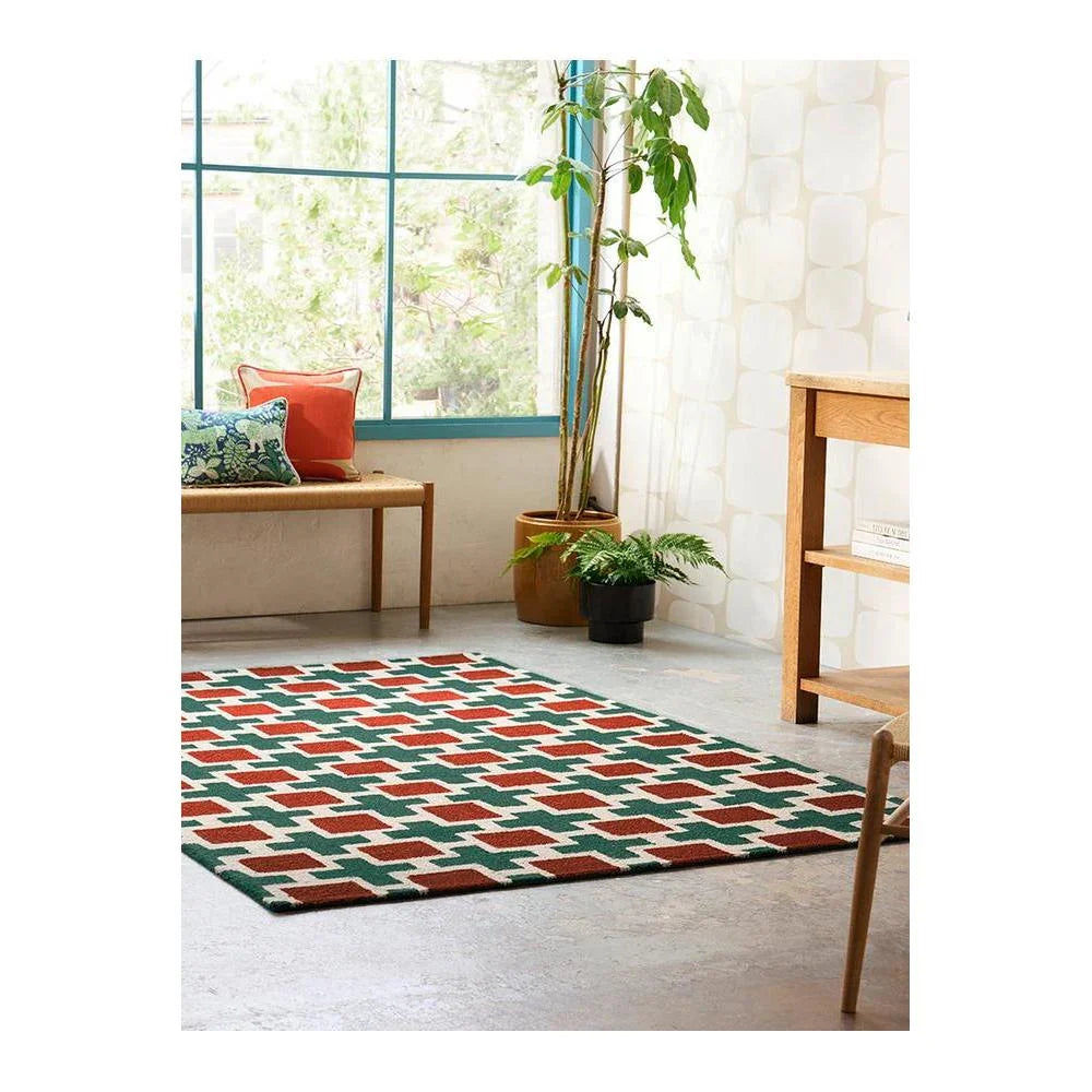 Scion Hatch - Rust Rug featuring geometric tile pattern in rust, emerald green and cream on ivory background, hand-tufted wool