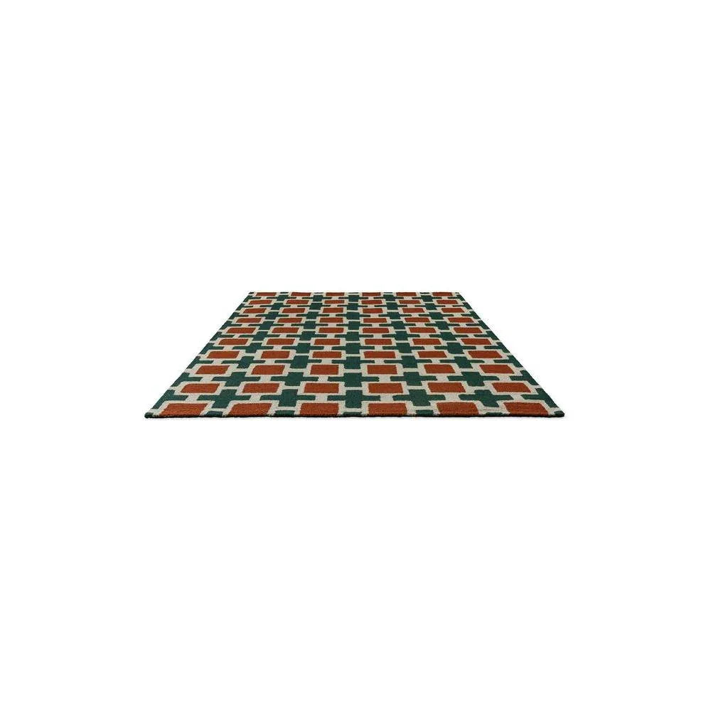 Scion Hatch Rust Designer Rug featuring geometric lattice pattern in rust, dark teal and cream on ivory background
