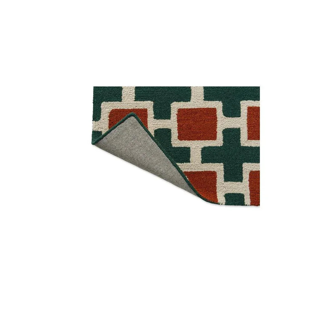 Scion Hatch Rust Rug featuring geometric lattice pattern in forest green, cream and rust on white background, hand-tufted wool