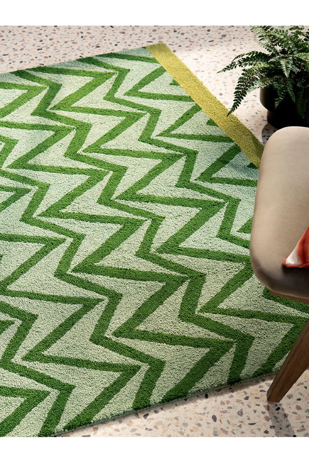 Scion Dhurrie Green Designer Outdoor Rug featuring geometric zigzag chevron pattern in emerald green, lime green, olive on cream background, handwoven cotton