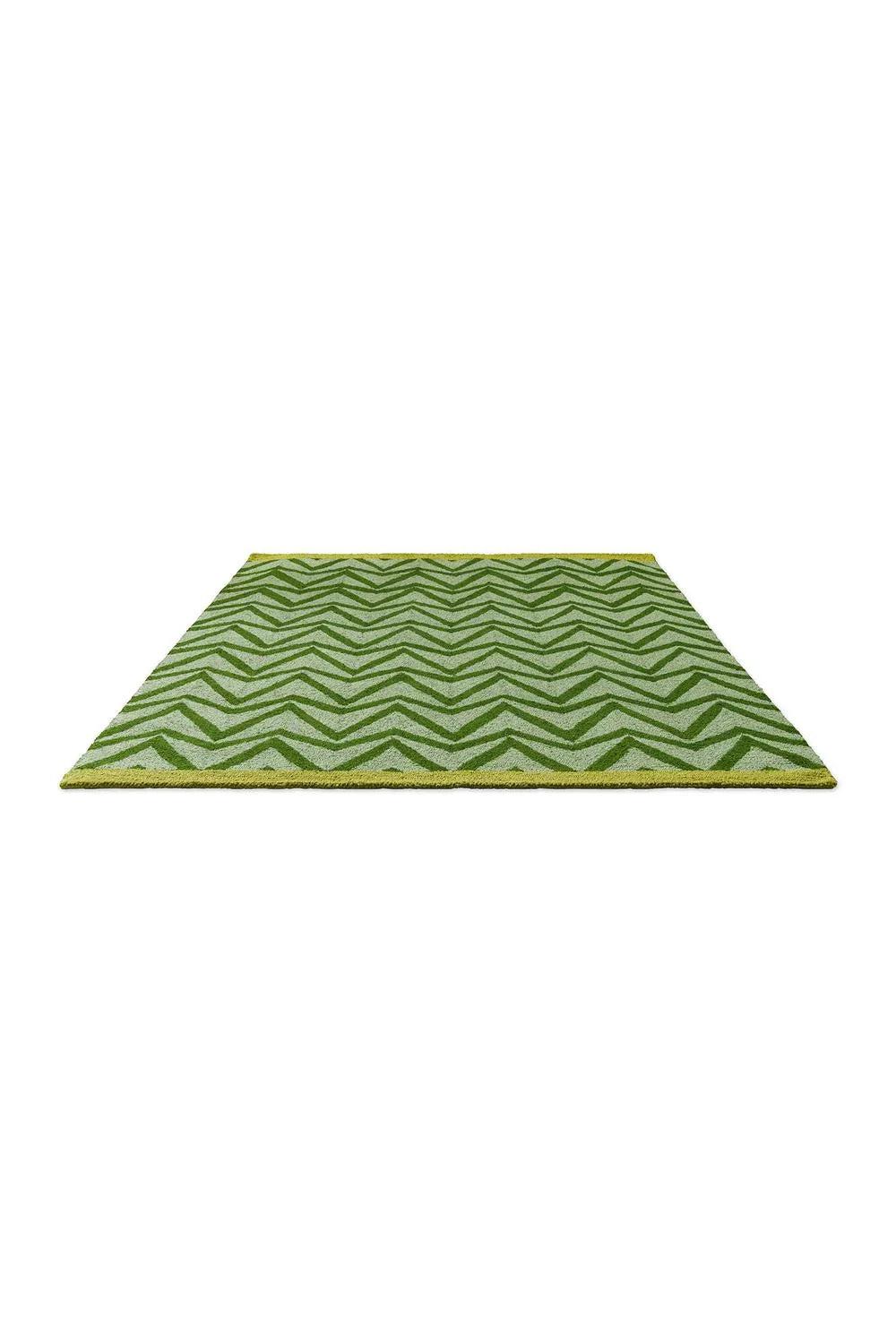 Scion Dhurrie Green Outdoor Rug featuring chevron in emerald, lime and sage on pale green background, hand-woven polypropylene