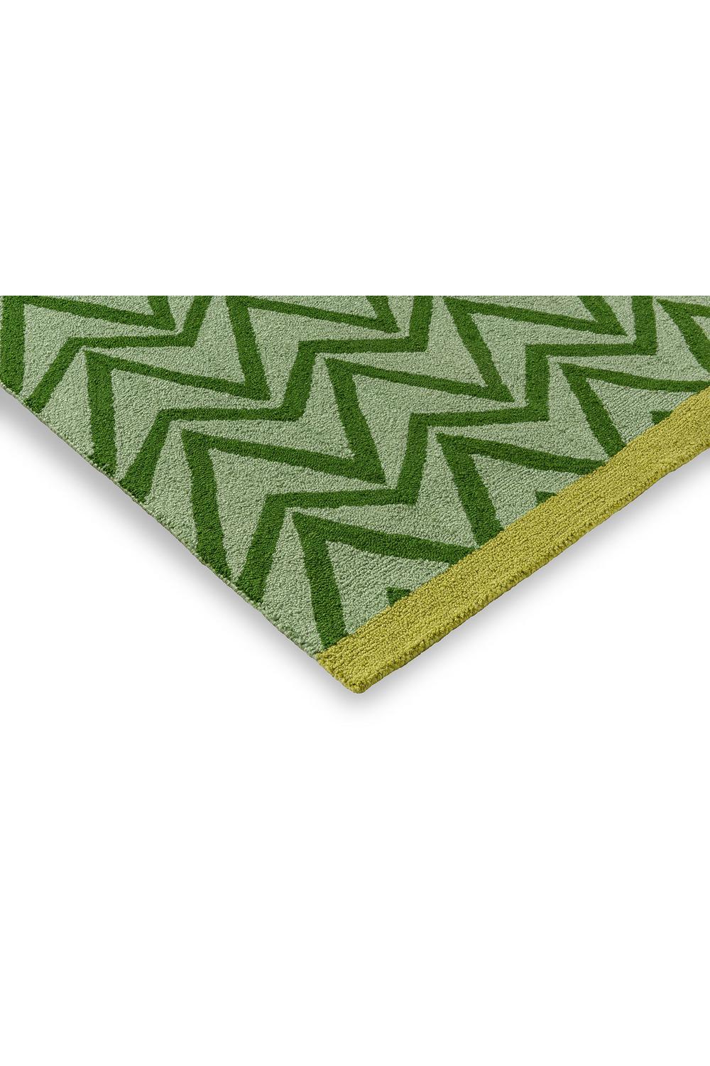 Scion Dhurrie Green outdoor rug featuring bold zigzag geometric pattern in emerald, sage, lime on light green, flat-weave outdoor rug