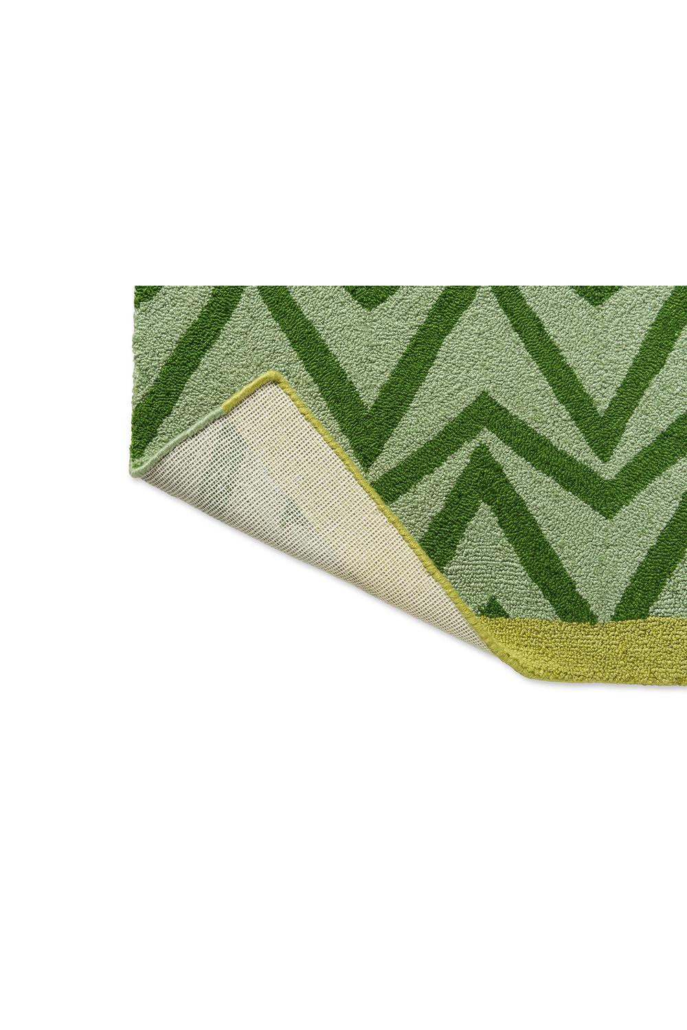 Scion Dhurrie Green Outdoor Rug featuring chevron geometric pattern in emerald, lime and sage on light green background, flatwoven outdoor rug