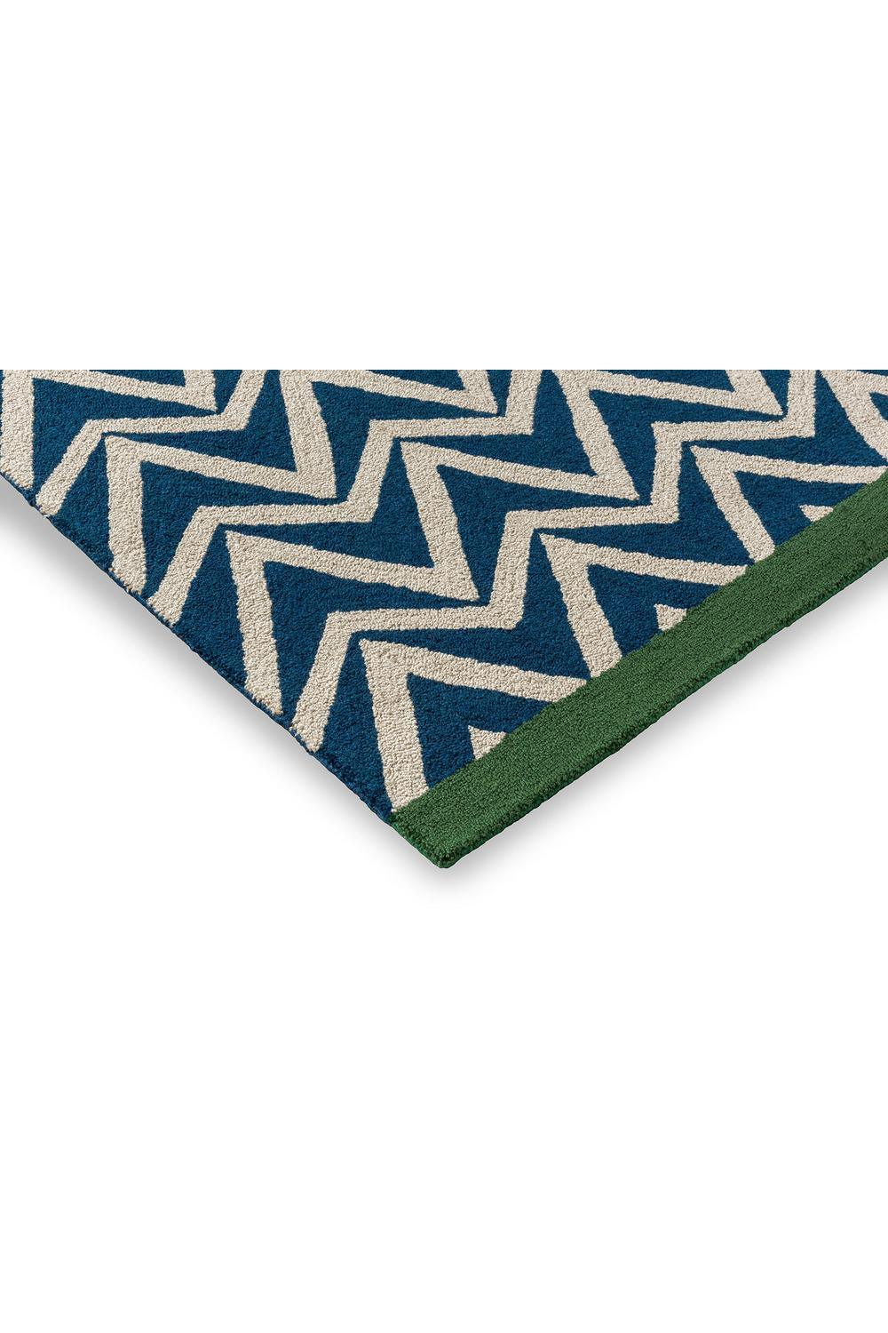 Scion Dhurrie Blue Outdoor Rug featuring zigzag pattern in navy blue, cream and sage green on navy field, power-loomed polypropylene