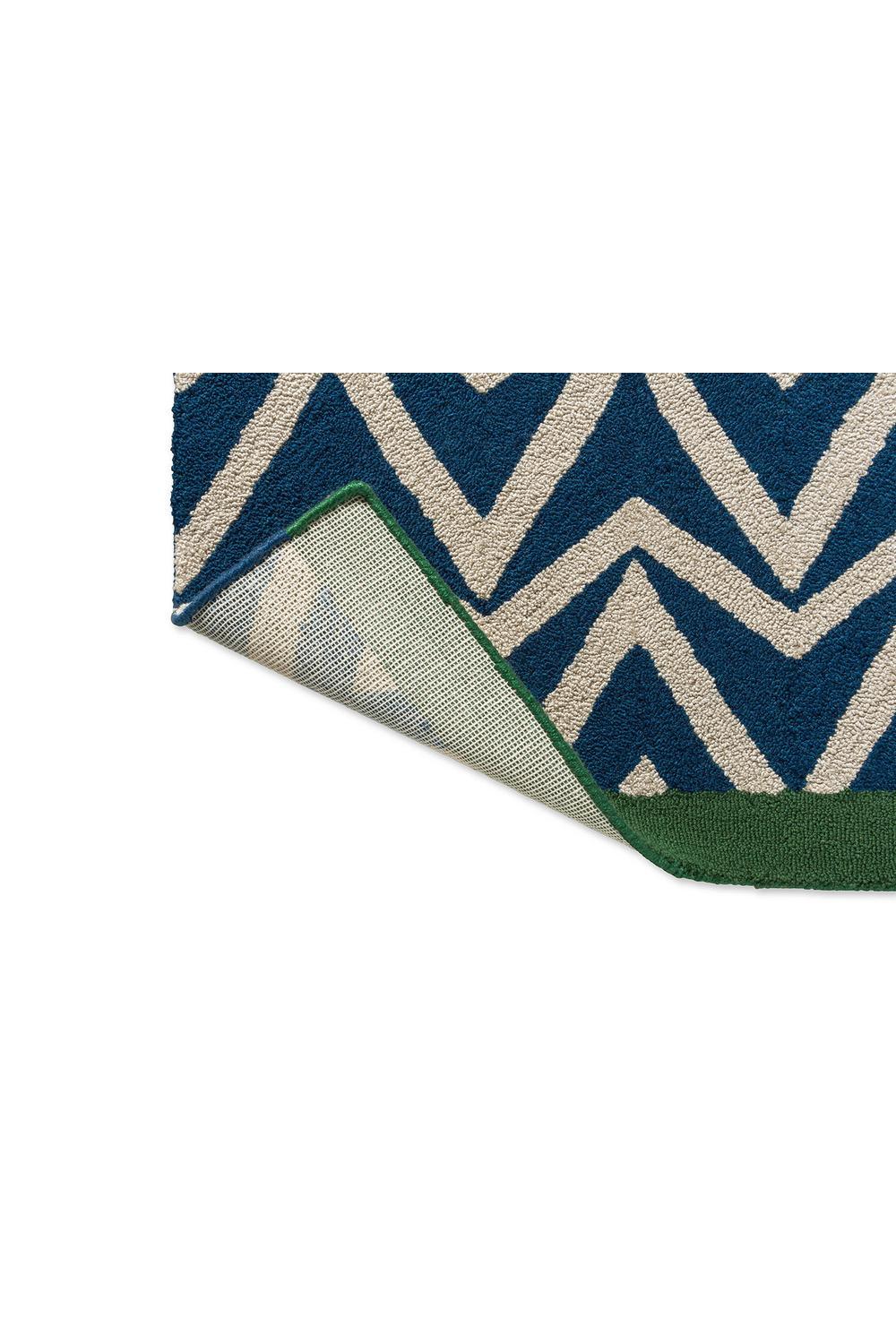 Scion Dhurrie Blue Outdoor Rug featuring chevron zigzag in navy blue and ivory with green border, flatweave polypropylene