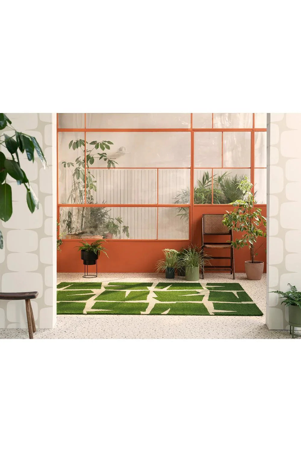 Scion Moqui Green Outdoor Rug featuring geometric panel pattern in emerald green, sage and cream on light terrazzo, machine-woven polypropylene