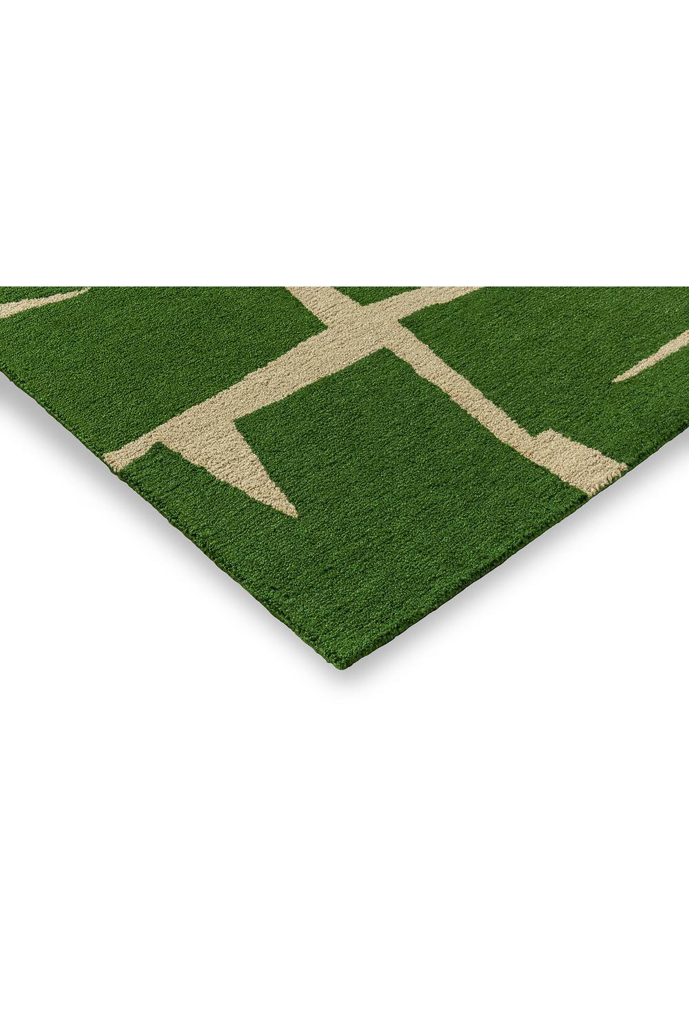 Scion Moqui Green Designer Outdoor Rug featuring geometric beige lines on emerald green, white background, power-loomed polypropylene