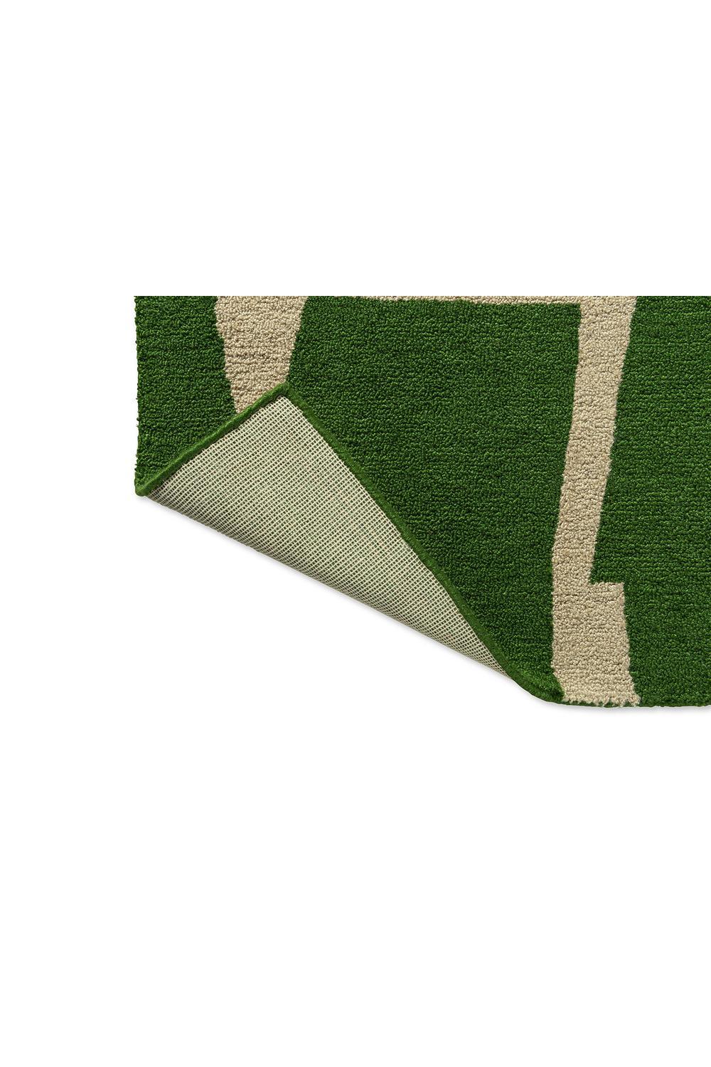 Scion Moqui Green Designer Outdoor Rug featuring geometric stripe pattern in moss green, sage and beige on white background, machine-made polypropylene