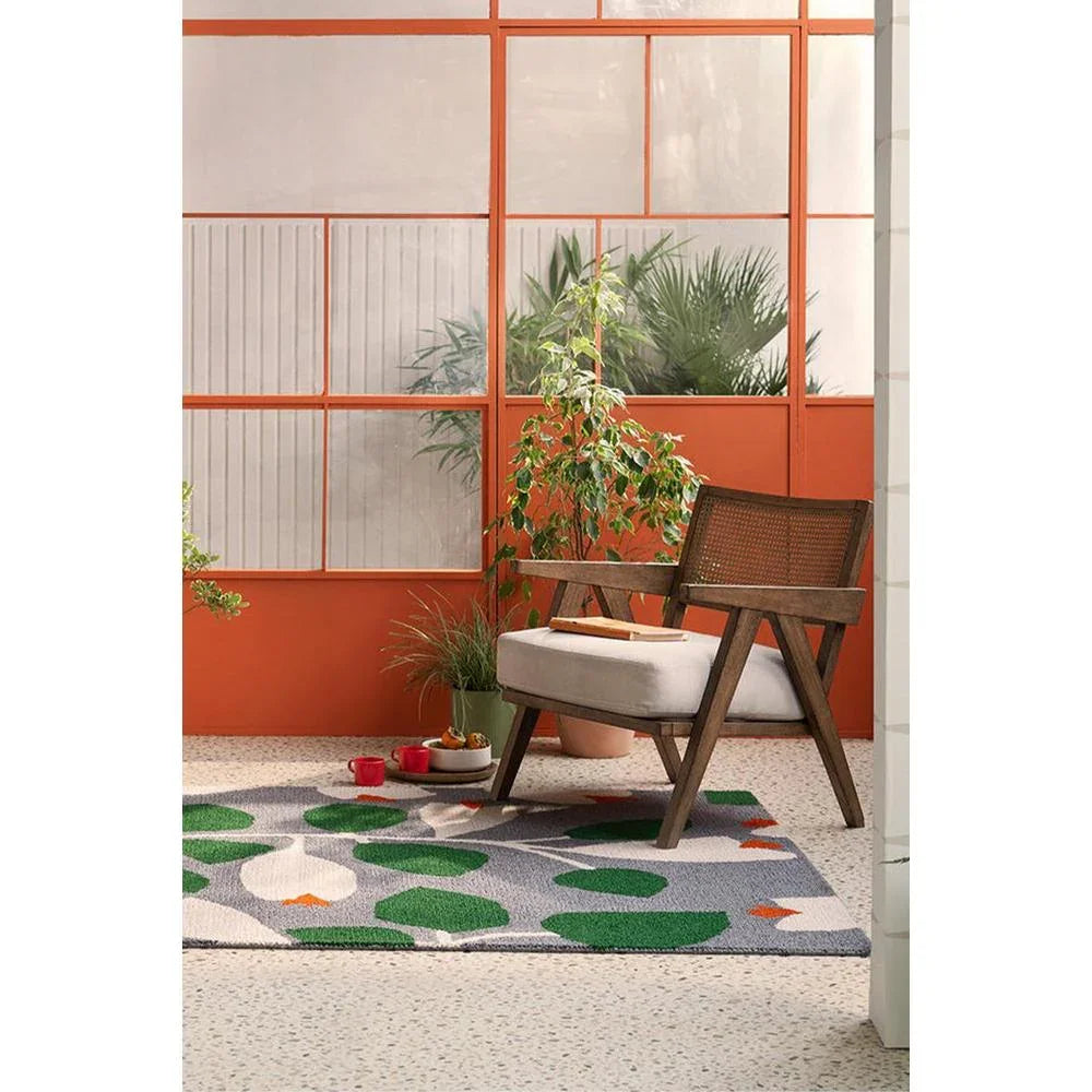 Scion Rosehip Blue Outdoor Rug featuring botanical leaf pattern in emerald green, sage, white on grey background, power-loomed polypropylene