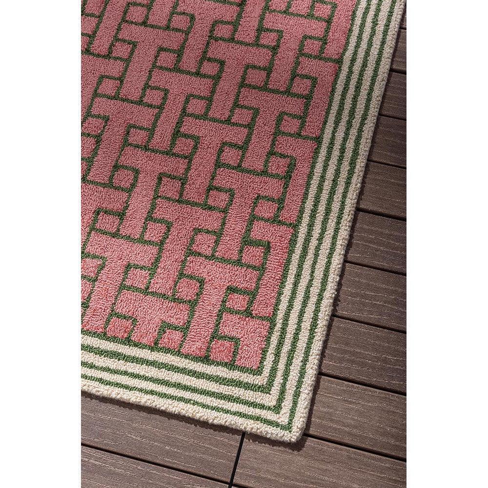Ted Baker T Monogram Dusted Pink Outdoor Rug featuring geometric monogram pattern in dusty pink, forest green and cream on cream border, power-loomed polypropylene