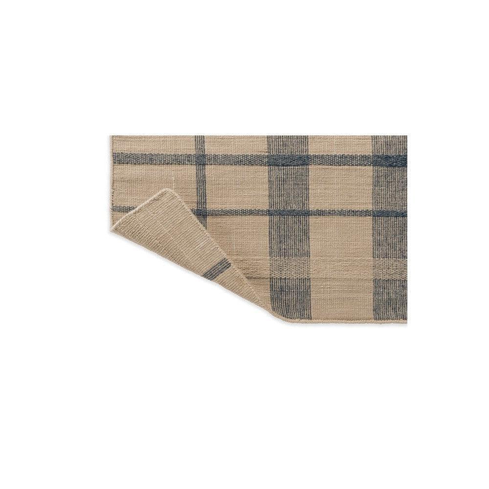 Brink & Campman Zona Denim Check Outdoor Designer Rug featuring plaid pattern in beige, navy blue and slate blue on tan background, flatwoven polypropylene