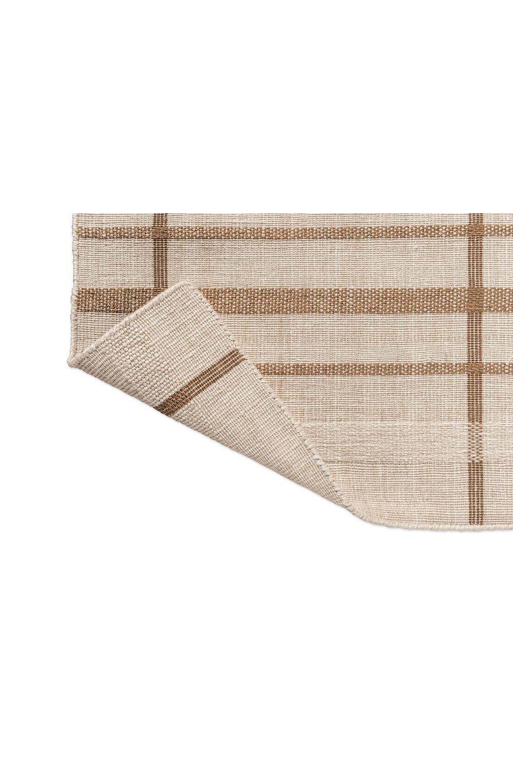 Brink & Campman Zona Sesame Line Runner featuring striped grid in cream, beige, tan and brown on pale background, outdoor flatweave polypropylene