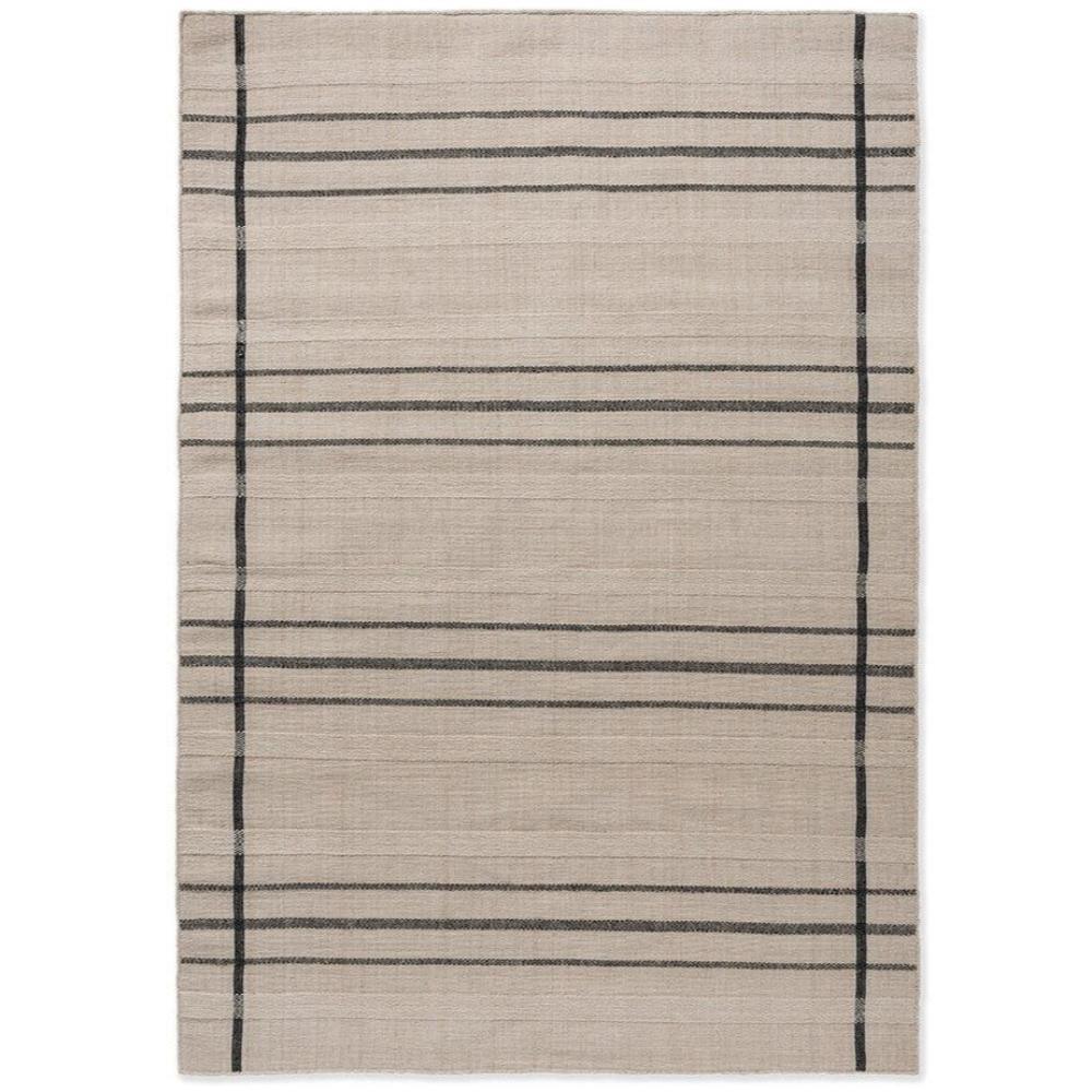 Zona Charcoal Line Outdoor Rug featuring a minimalist grid stripe pattern in beige with charcoal lines on a light taupe background.