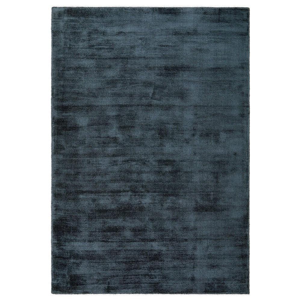 Joy Denim Rug from Bliss Collection featuring solid textured design in deep navy on white background, hand-tufted wool