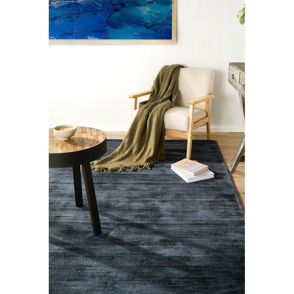 Joy Denim Rug featuring textured denim blue pattern in navy and steel on cream background, hand-tufted wool