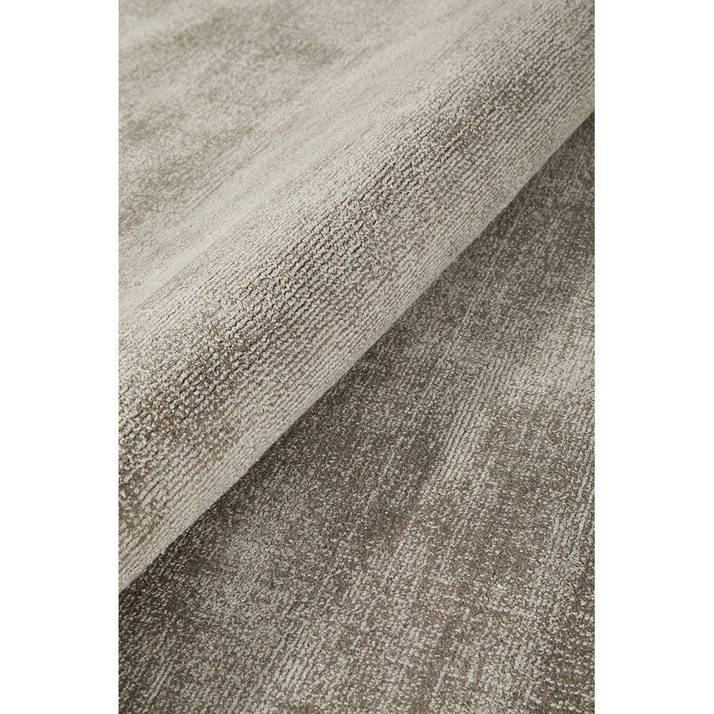 Joy Grey Rug featuring textured abstract pattern in charcoal, taupe and grey on light grey background, machine-made rug