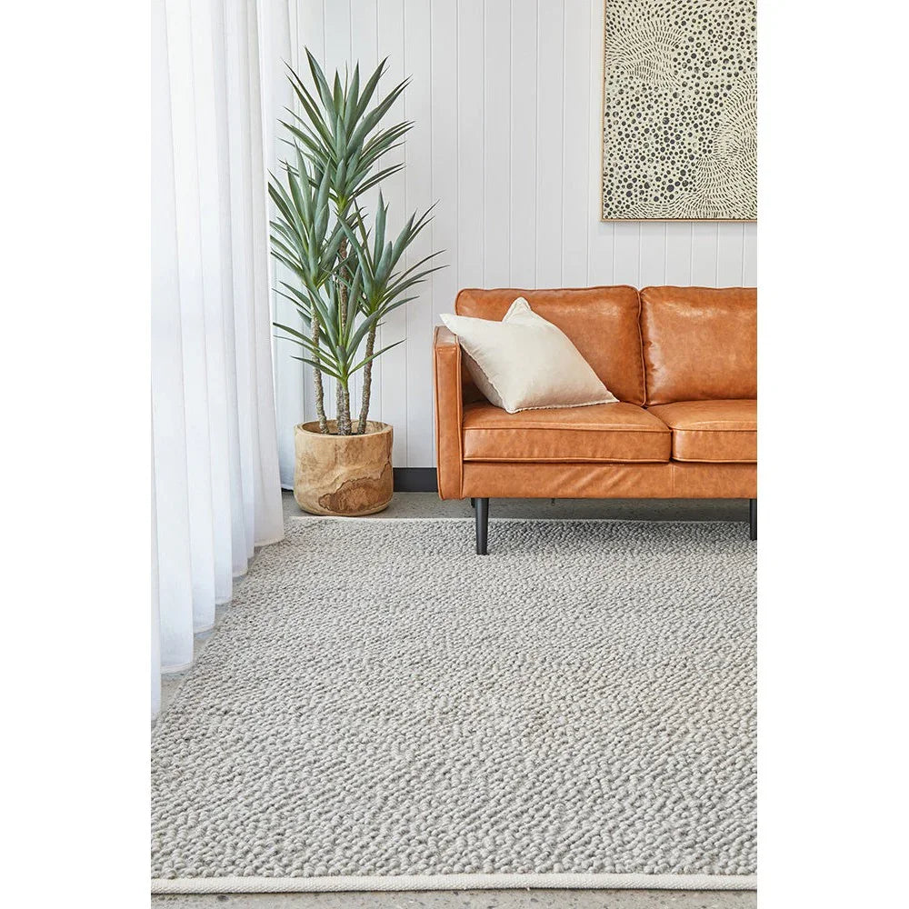 Boucle Grey Rug from Boucle Collection featuring boucle texture in grey on beige background, machine-made wool blend