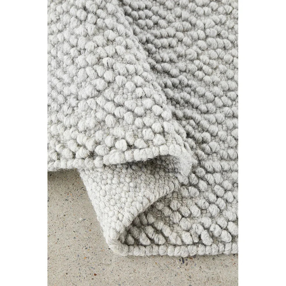 Boucle Grey Rug featuring boucle looped texture in light grey and ivory on a neutral background, hand-tufted wool blend
