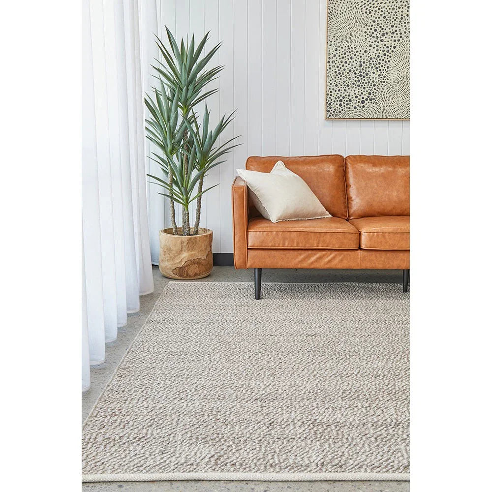 Boucle Natural Rug from Boucle Collection featuring textured loop pattern in cream, beige and taupe on natural beige background, hand-loomed wool