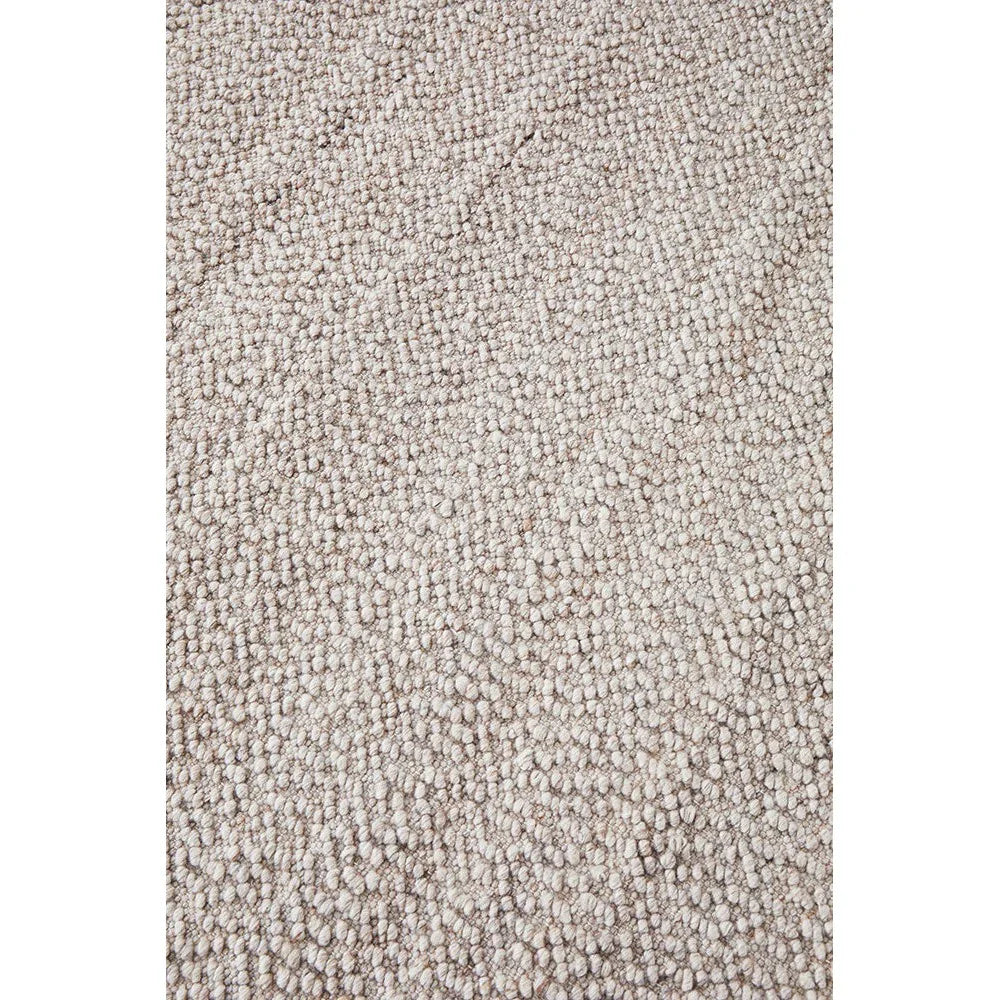 Boucle Natural Rug featuring boucle texture in beige, cream and taupe on cream background, hand-tufted wool