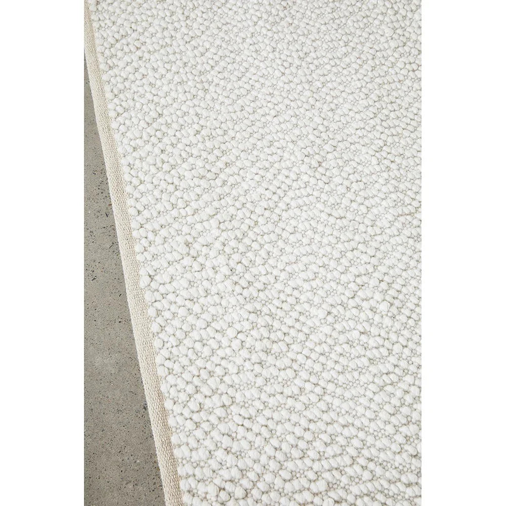 Boucle White Rug featuring shaggy boucle texture in ivory and cream on white background, hand-tufted wool