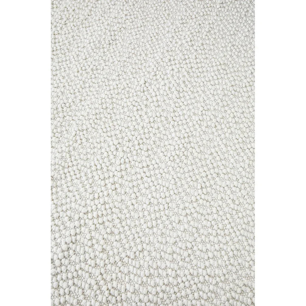 Boucle White Rug featuring boucle loop texture in cream and ivory on white background, hand-tufted wool