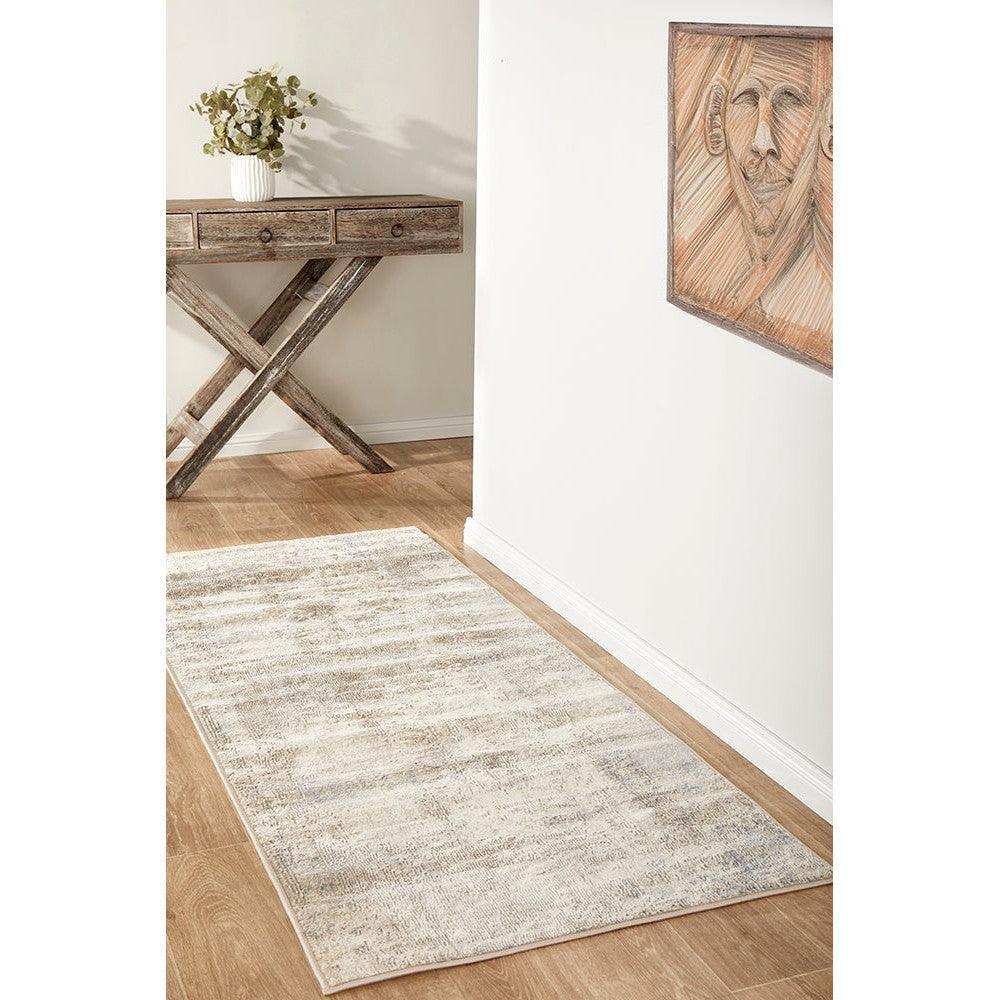 Bronte Aldo Sky Runner Rug featuring soft abstract distressed pattern in cream, beige and light grey on pale background, machine-woven rug
