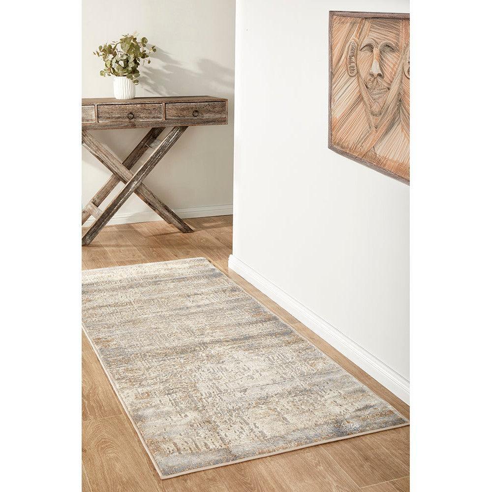 Bronte Nola Powder Runner Rug featuring subtle distressed pattern in powder, ivory and taupe on beige background, machine-made polyester