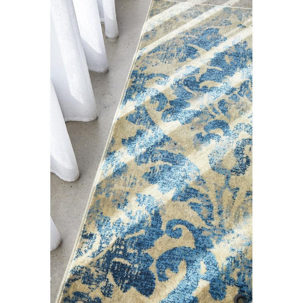 Calypso Bone Rug featuring damask floral pattern in blue on bone background, hand-tufted wool