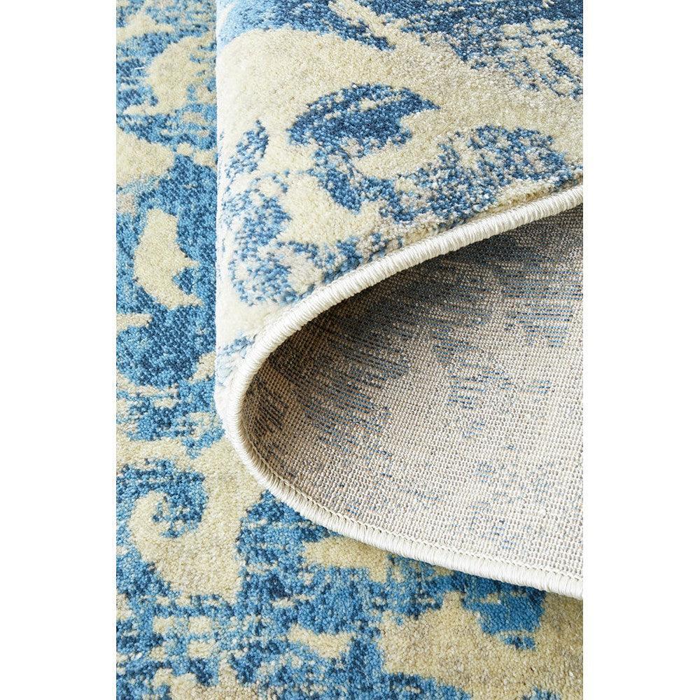 Calypso Bone Rug featuring damask pattern in navy blue and cream on ivory background, hand-tufted wool