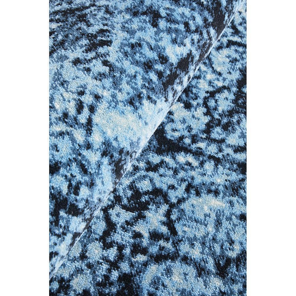 Calypso Navy Rug featuring abstract pattern in sky blue, cobalt blue and navy on deep blue background, hand-tufted wool