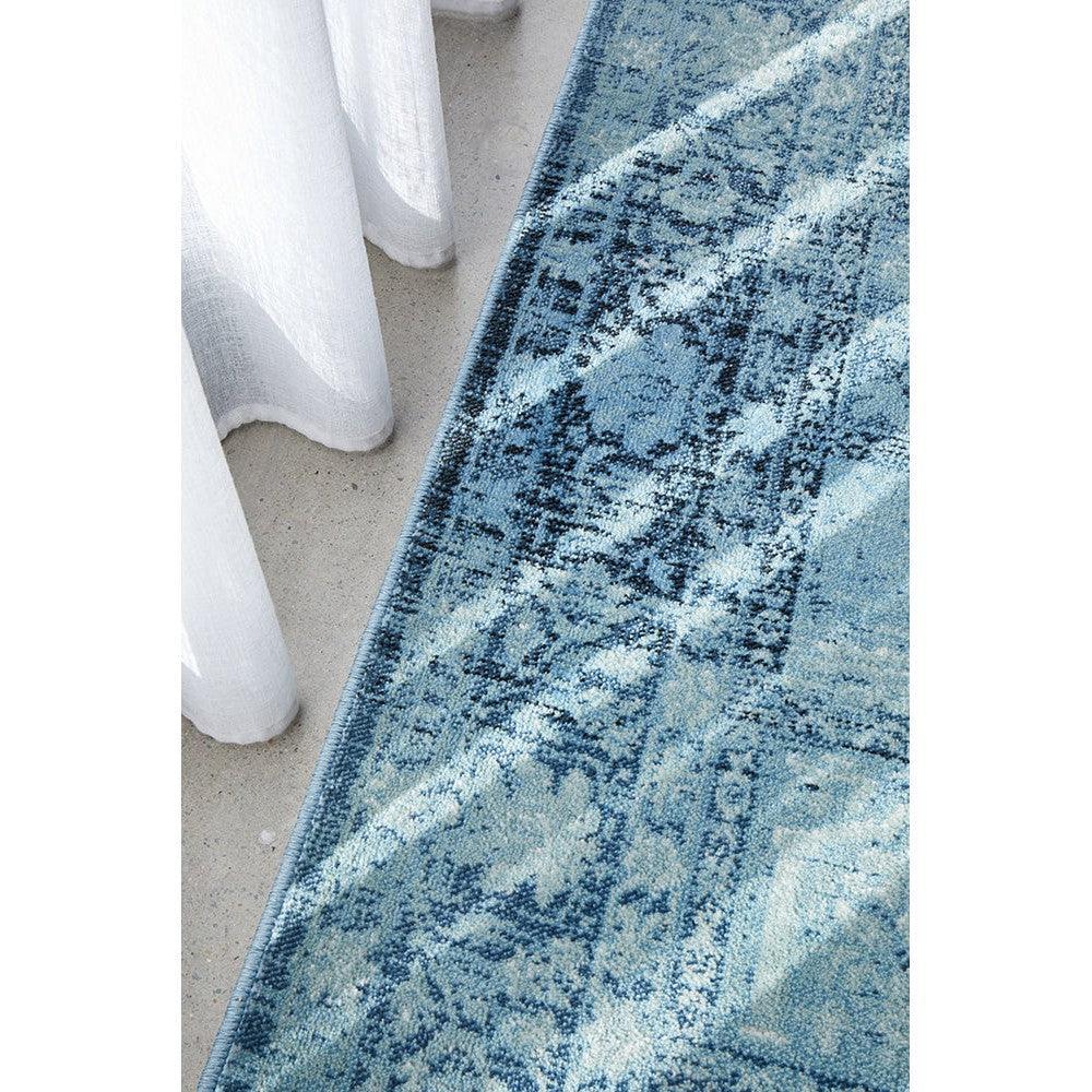 Calypso Blue Rug by Rug Culture: abstract distressed pattern in navy, sky blue and cream on blue background, hand-tufted wool
