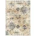 Calypso Bone Rug featuring distressed floral motif in beige, cream, navy and pale blue on bone background, machine-made.