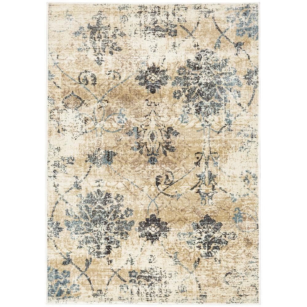 Calypso Bone Rug featuring distressed floral motif in beige, cream, navy and pale blue on bone background, machine-made.